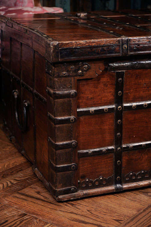 Oversize Anglo-Indian Teak and Iron Strapwork Trunk with Two Handles, Hinged Lid, and Double Latches: Fitted Interior with Compartments.  Ideal as a Large and Sturdy Coffee or Family Room Table. Anglo India, c. 1860<br />
<br />
53 inches wide x