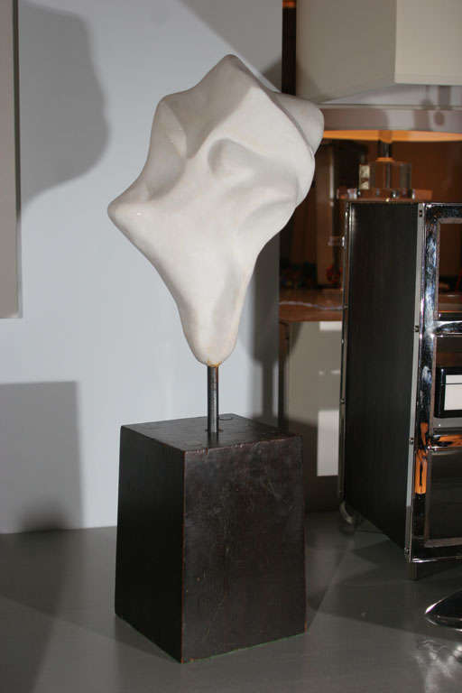 Abstract plaster sculpture mounted on iron stand with tapered square pedestal base circa 1960