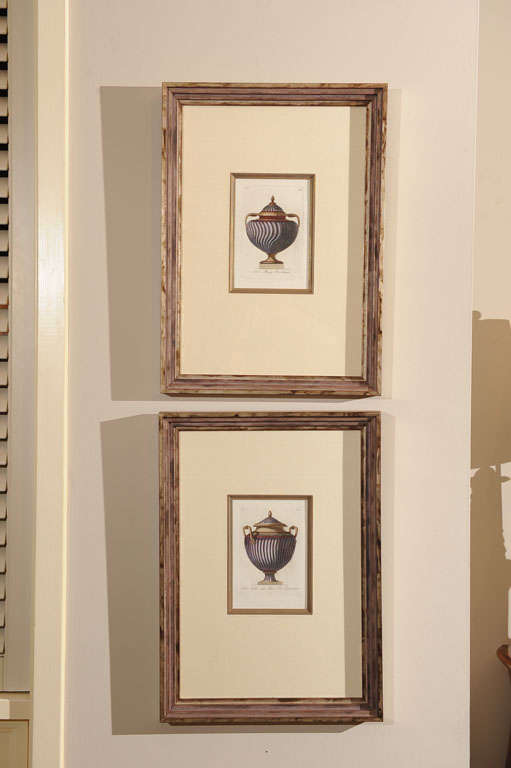 Early 19th century Italian pair of hand colored engravings with gold copper leaf accents of Antonini vases titled Nel Museo pio-Clemen and Vaso Antico Nel Museo Pio Clementino. Each with silk mats in hand-carved silver leaf polychrome antique