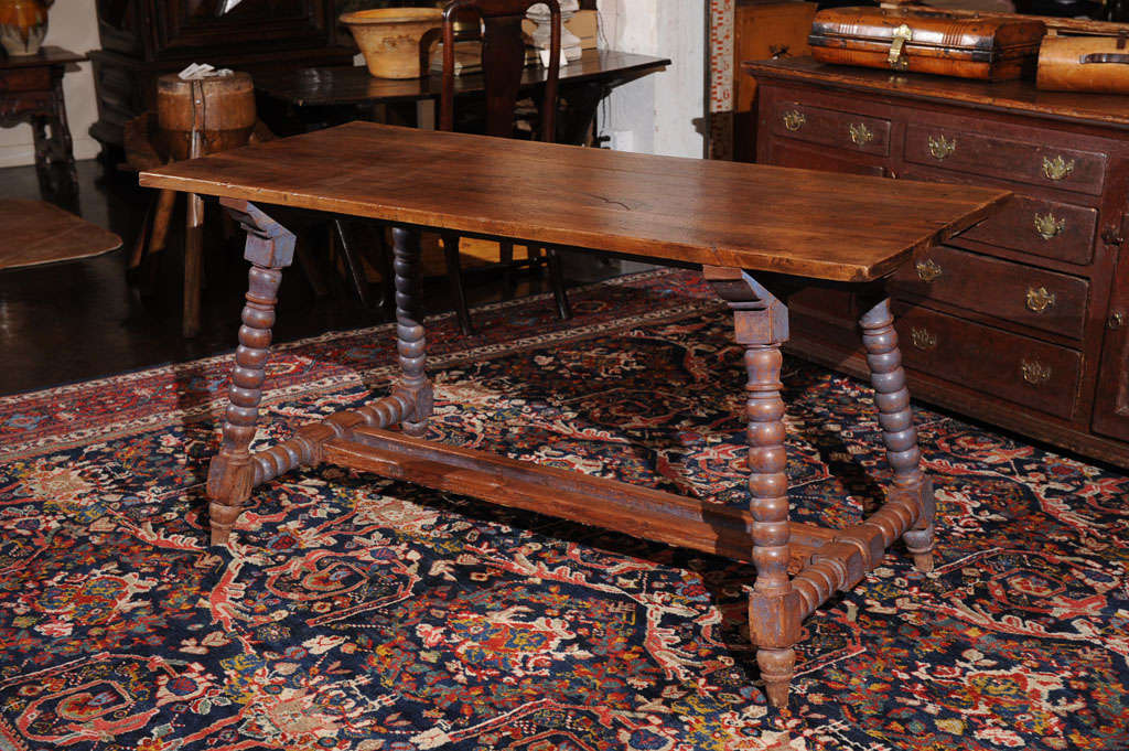 Spanish Trestle table with painted Bobbin turned legs and walnut top, circa 1880.