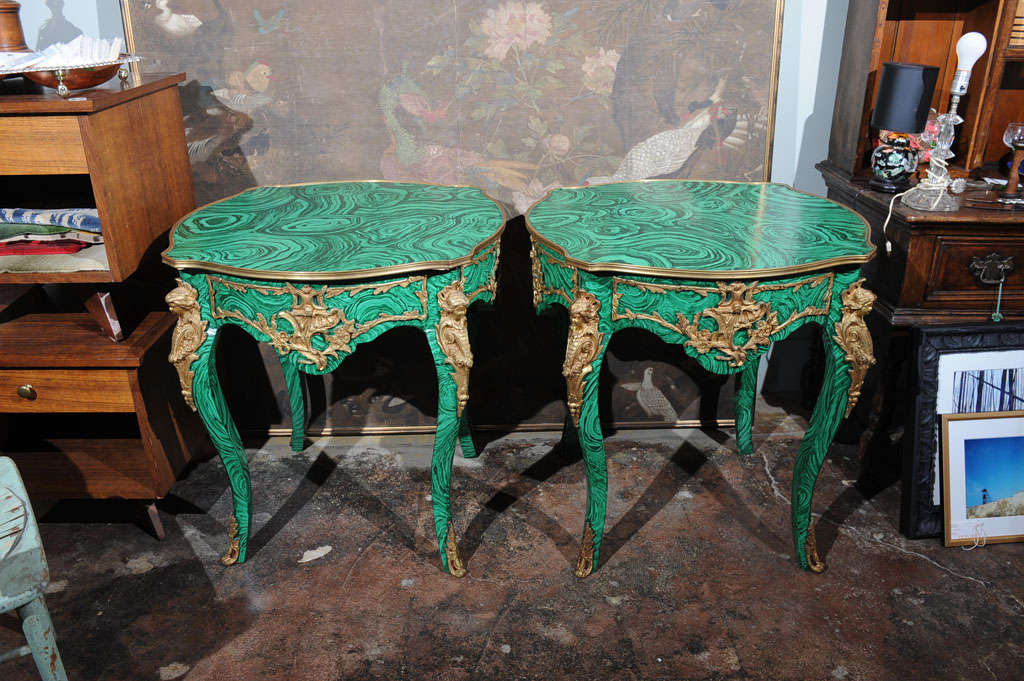 Pair of hand-painted French tables with original ormolu. Finish is in rich green faux malachite finish created by Tony Duquette. He painted with most of the gold trim in place, so there's green paint found on some of ormolu which we find to give