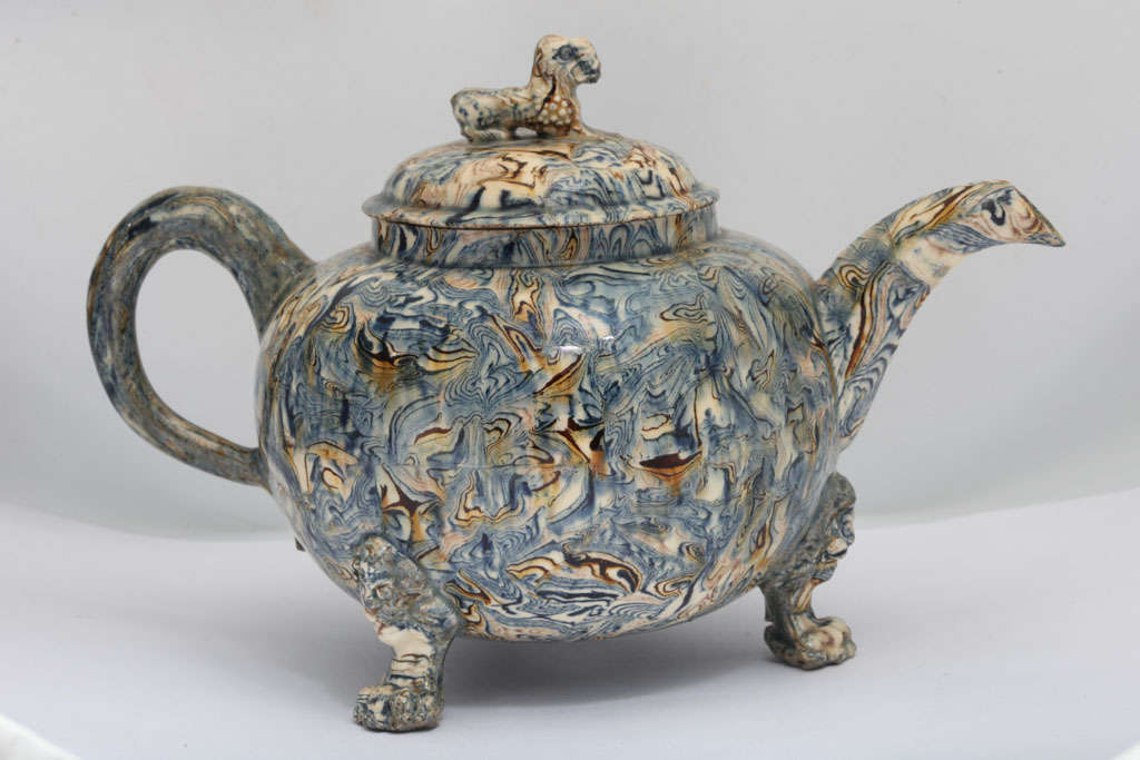 A rare English solid agate pottery teapot on three lion's head and paw feet, Chinese lion finial