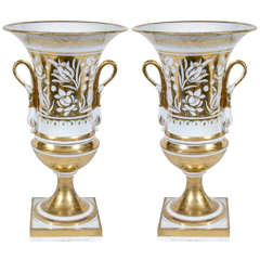 A Pair of French White and Gold Urns