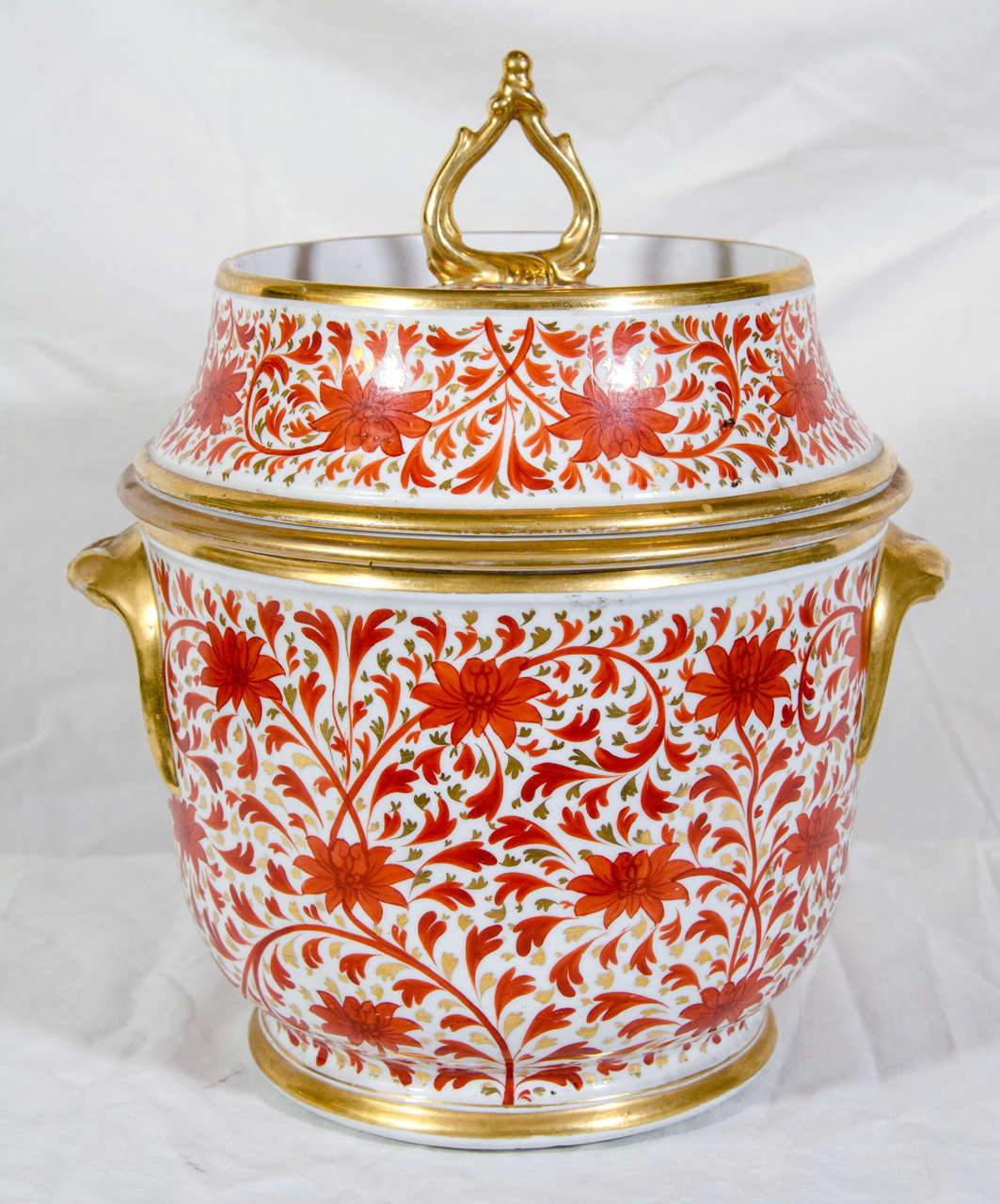 A Coalport ice pail with overall decoration of chrysanthemums and swirling leaves painted in iron red and beautiful gilt.
Ice pails were also called fruit coolers. They were the 18th and 19th century equivalent of today's ice cream maker.