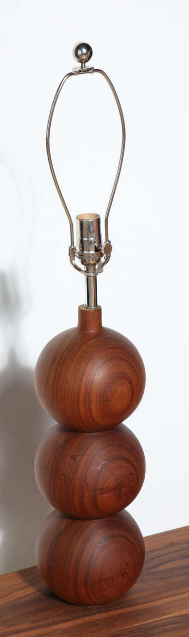 2 classic 50's-60's Teak Lamps from Denmark featuring beautiful wood grain and solid stacked triple ball design.  Rewired