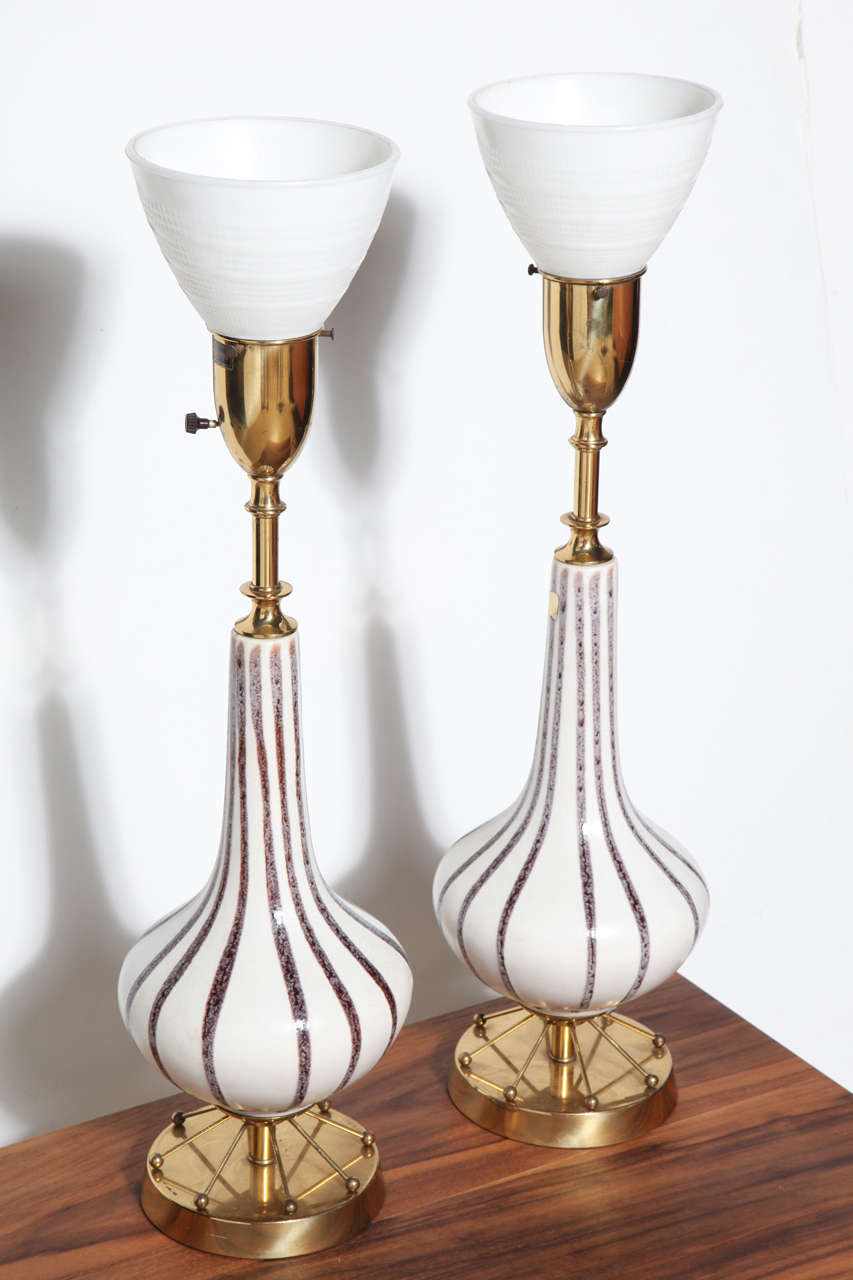 Pair of Atomic Regency Rembrandt Lamp Company Ceramic and Brass Table Lamps with White milk glass Shades, Circa 1950's. Featuring Off-White glazed ceramic gourd form with thin hand-painted speckled striping in Gray, Brown, Maroon with Brass socket,