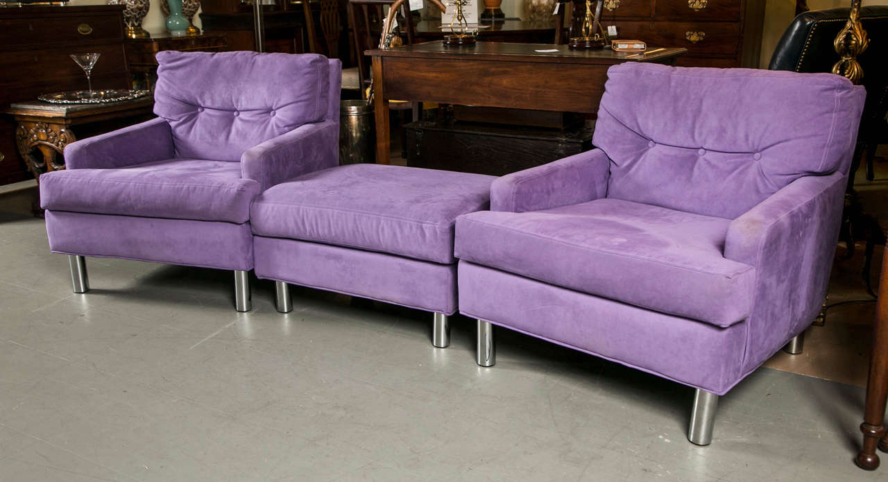 A pair of mid century Lilac Ultra Suede club chairs with ottoman, set on chrome legs. Circa 1970.