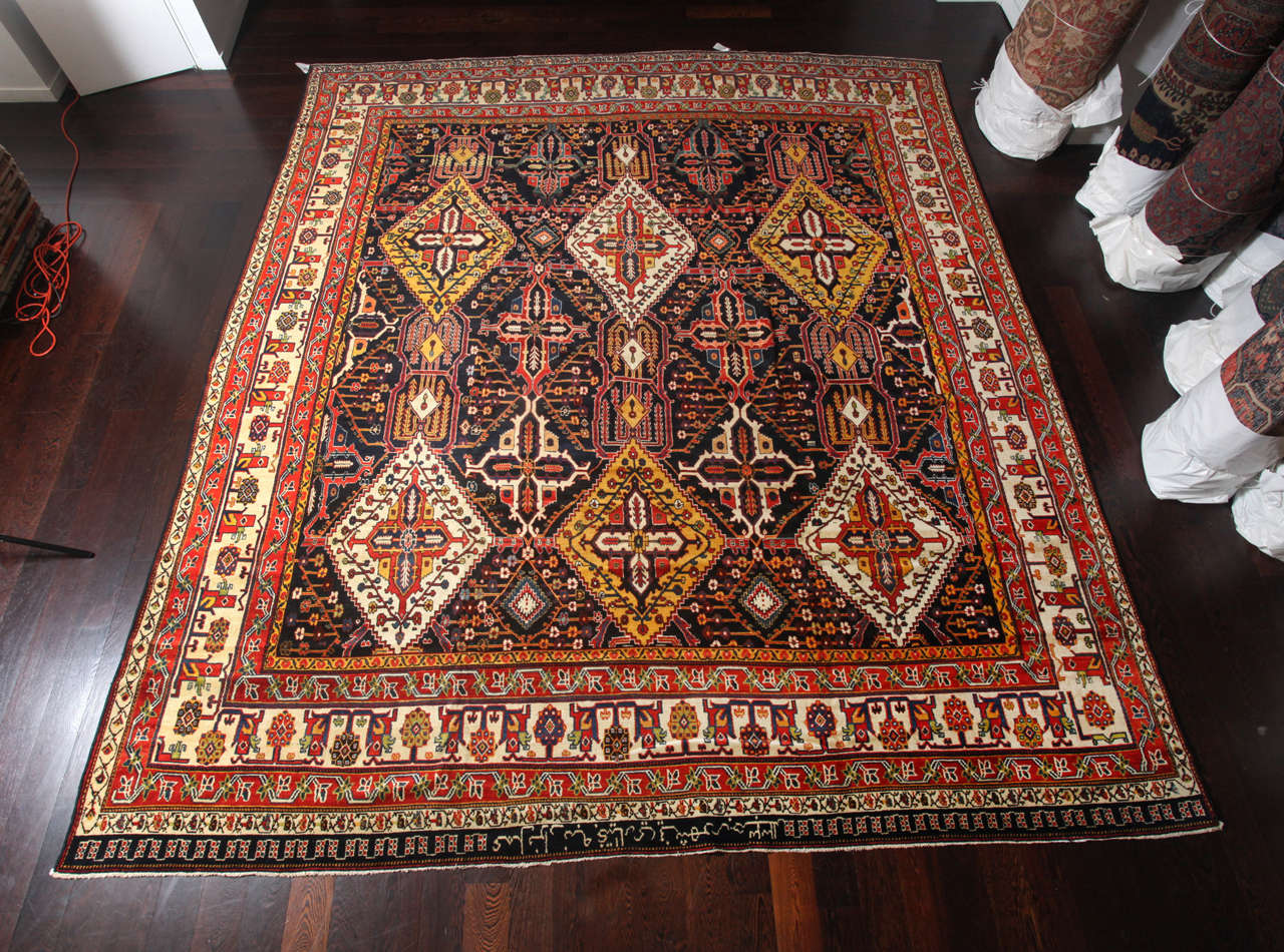 This Persian Bakhtiari ZeleSultan carpet by master weaver Ardal was created, circa 1890. It consists of a hand-knotted wool pile, wool weft, cotton warp and natural vegetable dyes. Ardal, one of the most renowned master weavers of his time and