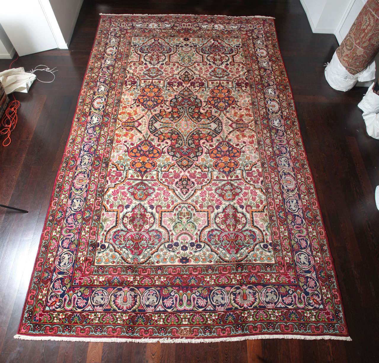 This Persian Yazd carpet circa 1910 consists of a hand-knotted handspun wool pile and natural vegetable dyes. The size is 10' x 16'9