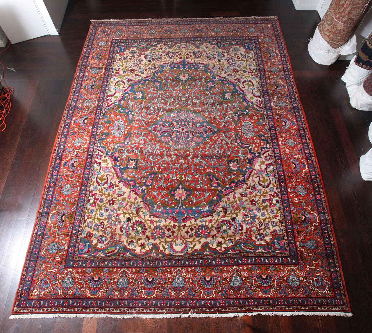 This Persian Kermanshah carpet features a Safavid Dynasty design and was created with a cotton warp and thread, hand-knotted handspun wool pile and natural vegetable dyes, circa 1880. Its design is highly innovative, with its medallion extending