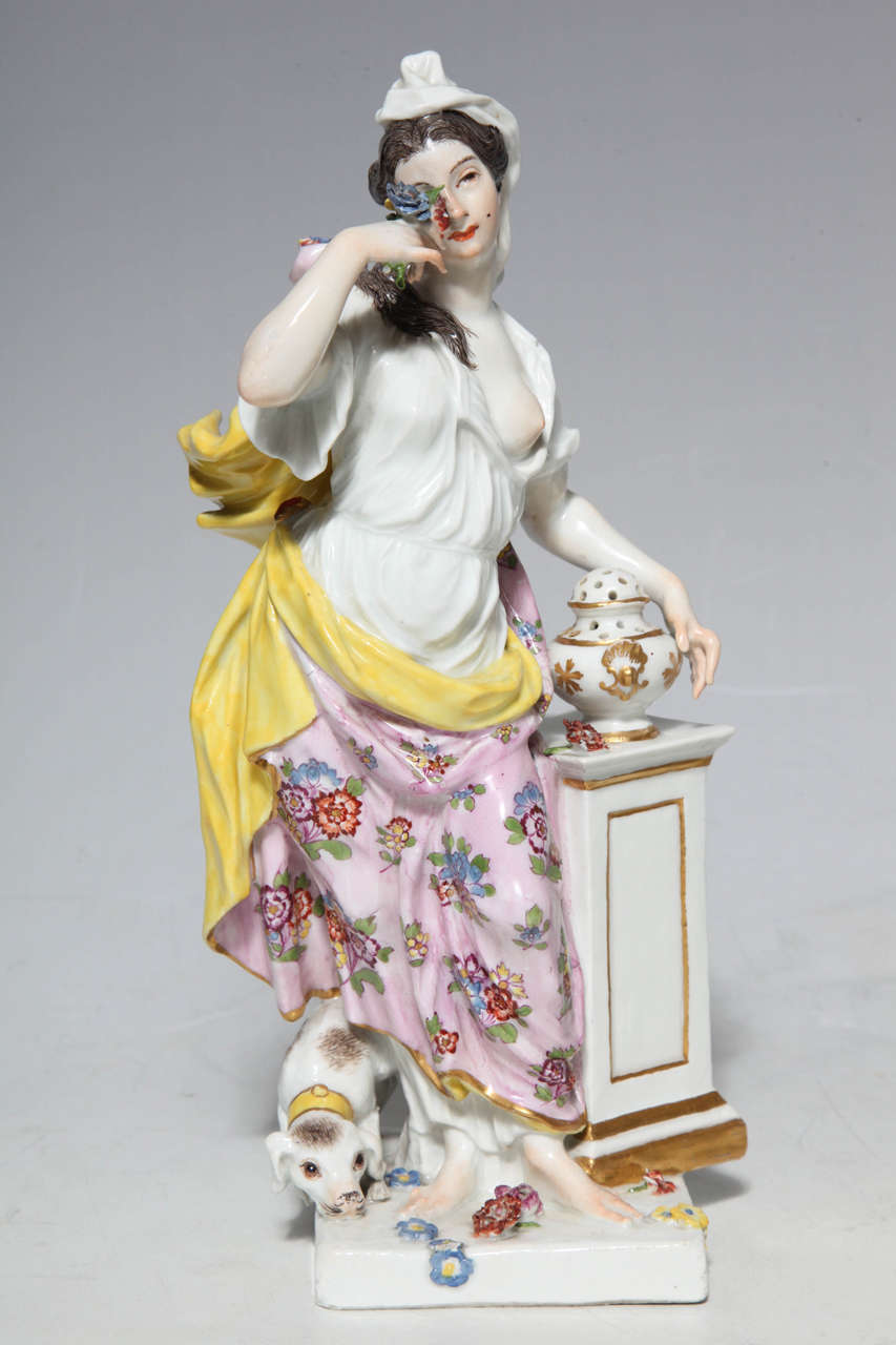 A fine pair of 18th century Meissen Porcelain allegorical figurines of smell and hearing from a set of the senses probably modeled by J.J. Kandler. Each group is on a footed square base. 

Smell wearing a yellow-lined flowered white robe and