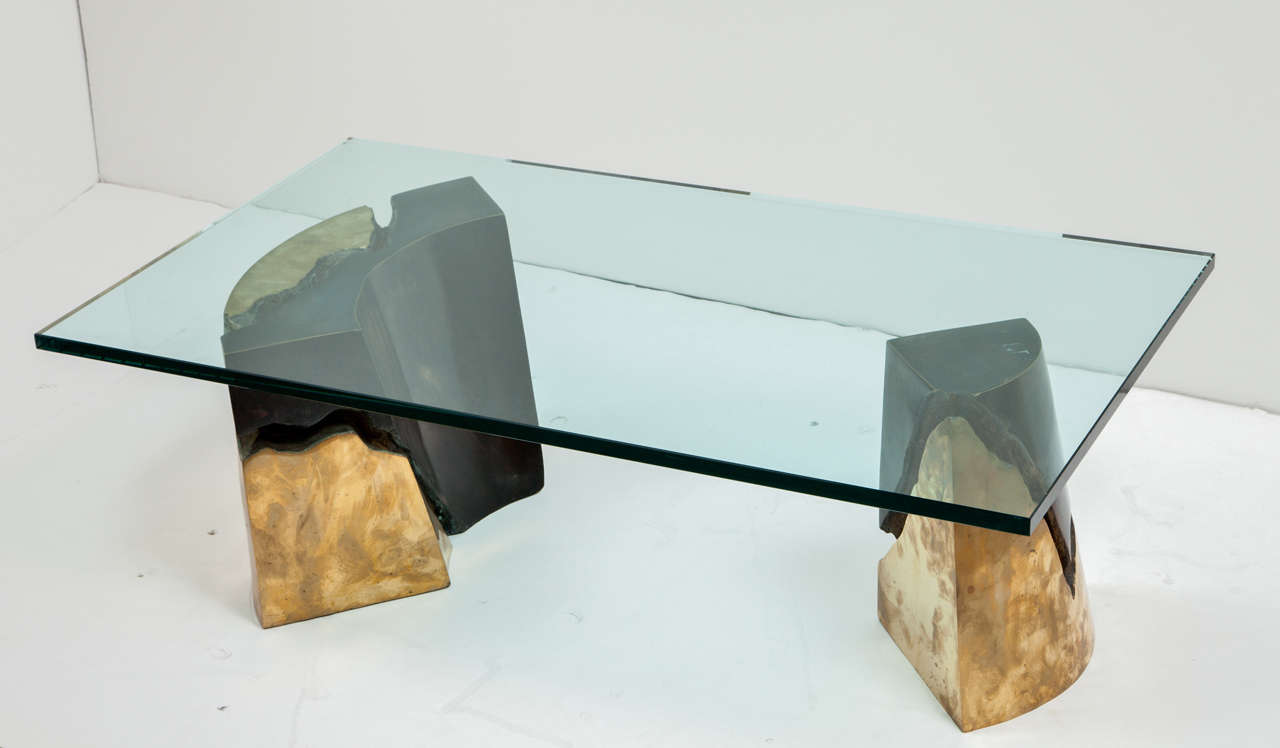 Bronze base table with glass top.

Probably made in less than eight exemplars.
Glass can be easily changed for another dimensions.
