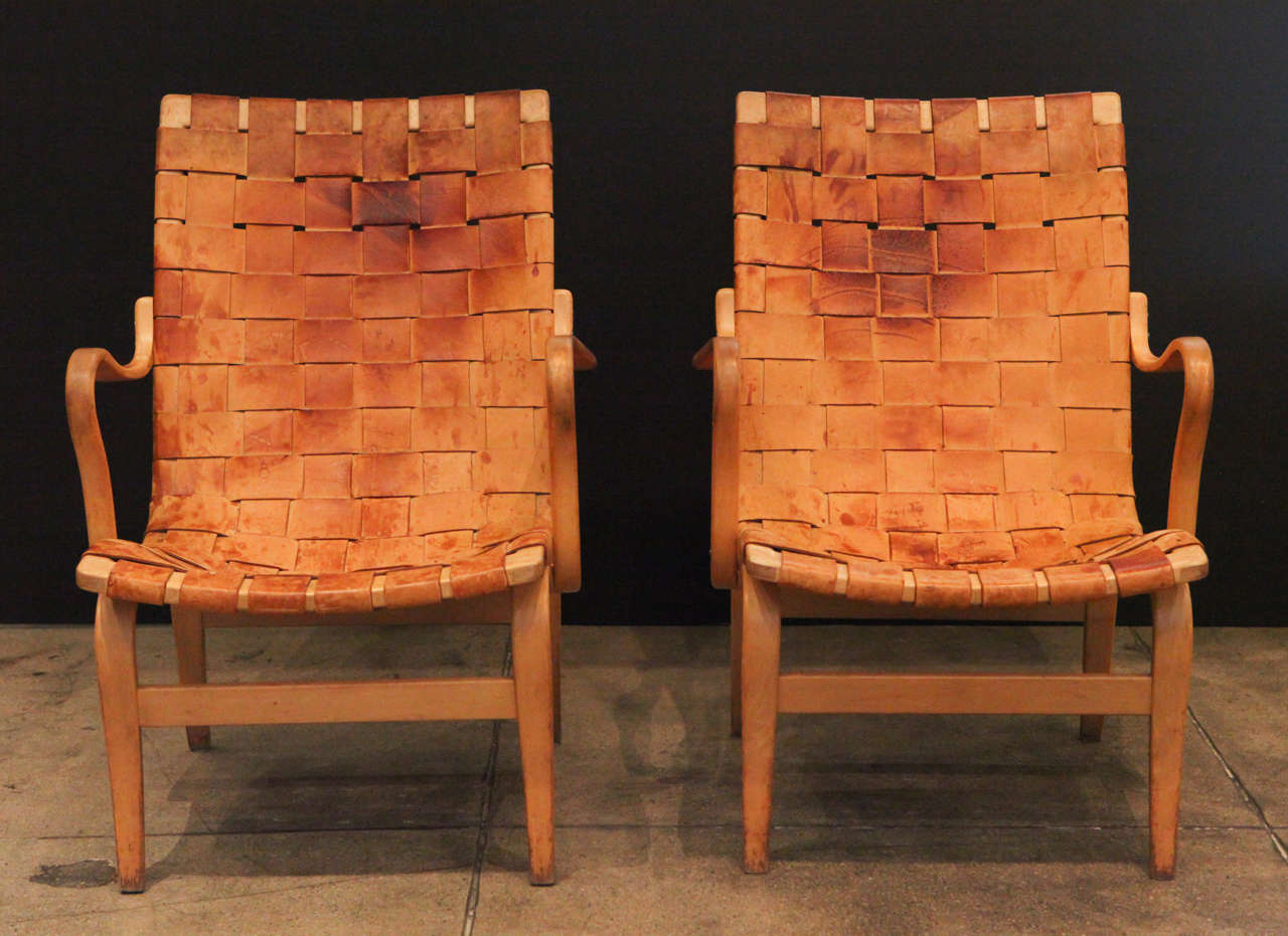 A pair of 'Eva' chairs by Swedish designer Bruno Mathsson. Produced in 1965 by Karl Mathsson.
