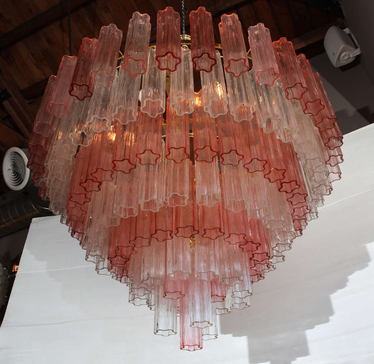 Pair of Elegant Pink and Clear Tronchi Chandeliers in the Style of Venini
Each piece of glass is hand blown, approximately 10