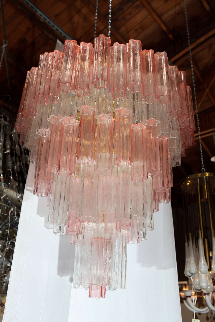 A glamorous pair of Venini medium tronchi star-shaped (pink and clear) glass chandeliers.