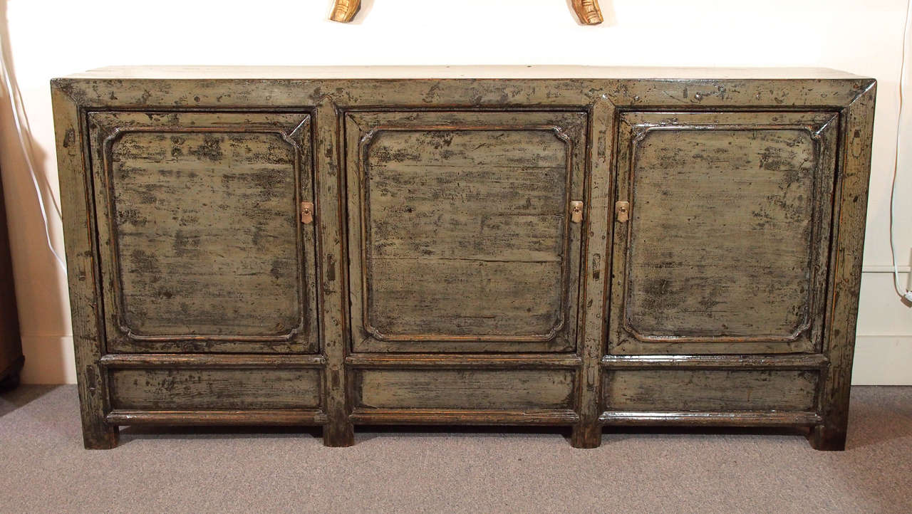 Antique Chinese light olive green lacquer 3-door sideboard from Shanxi Province. Circa 1890.