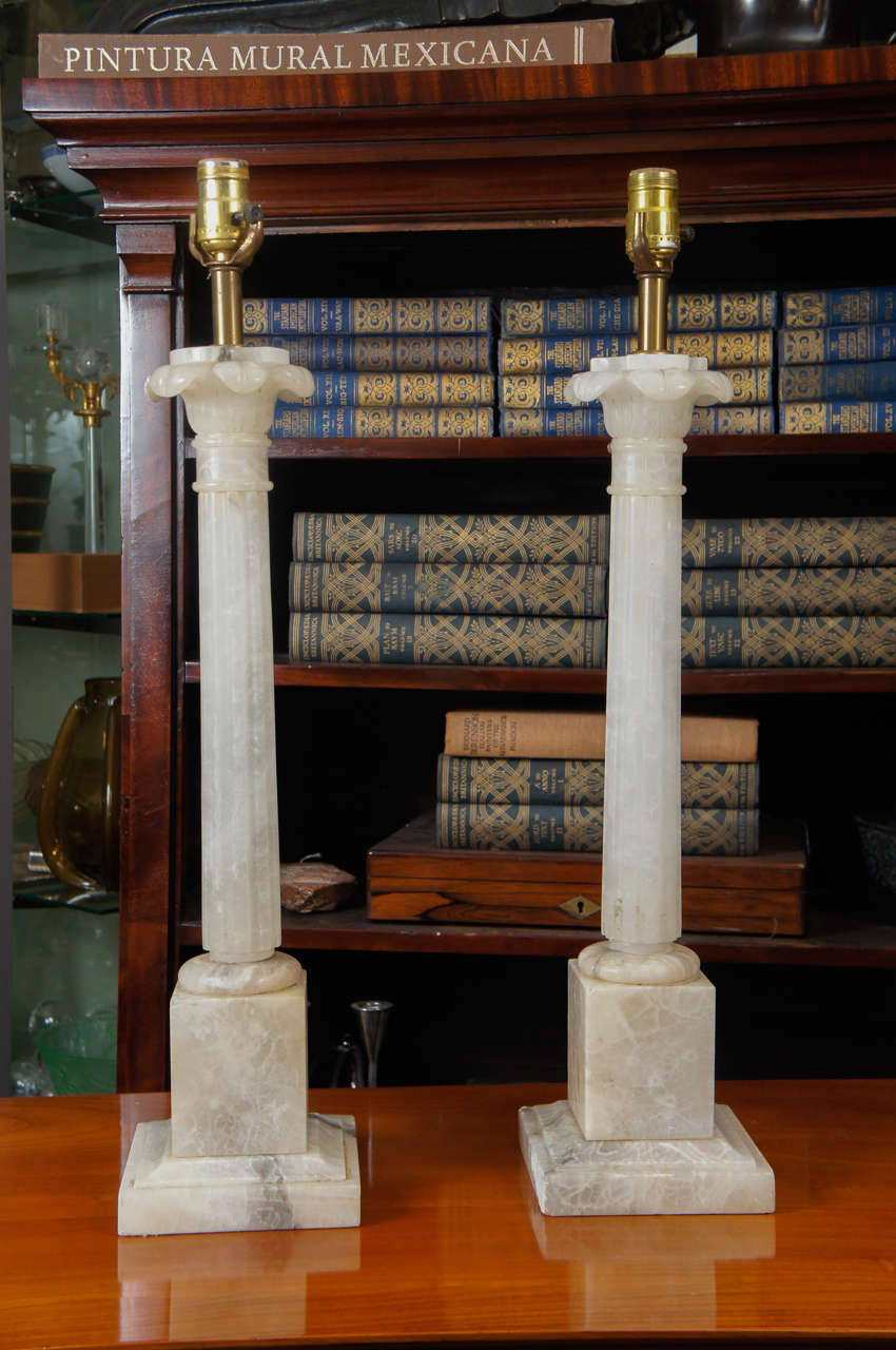 Pair of classical white marble column lamps.