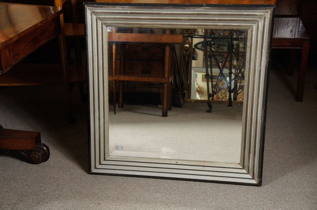 Art deco mirror frame. Silver leaf with black border.