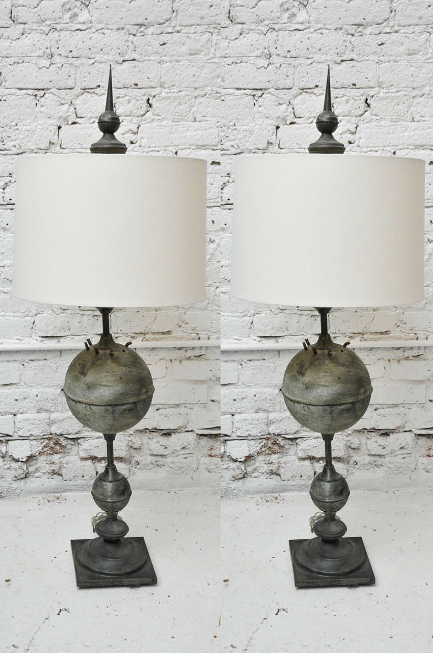 Pair of Antique Metal Urn Lamps, topped with dramatic statement finials