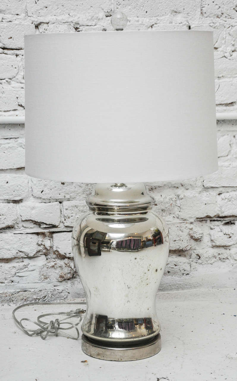 Beautiful vintage mercury glass urn shaped base lamp given a gorgeous update with new shade and Lucite finial.