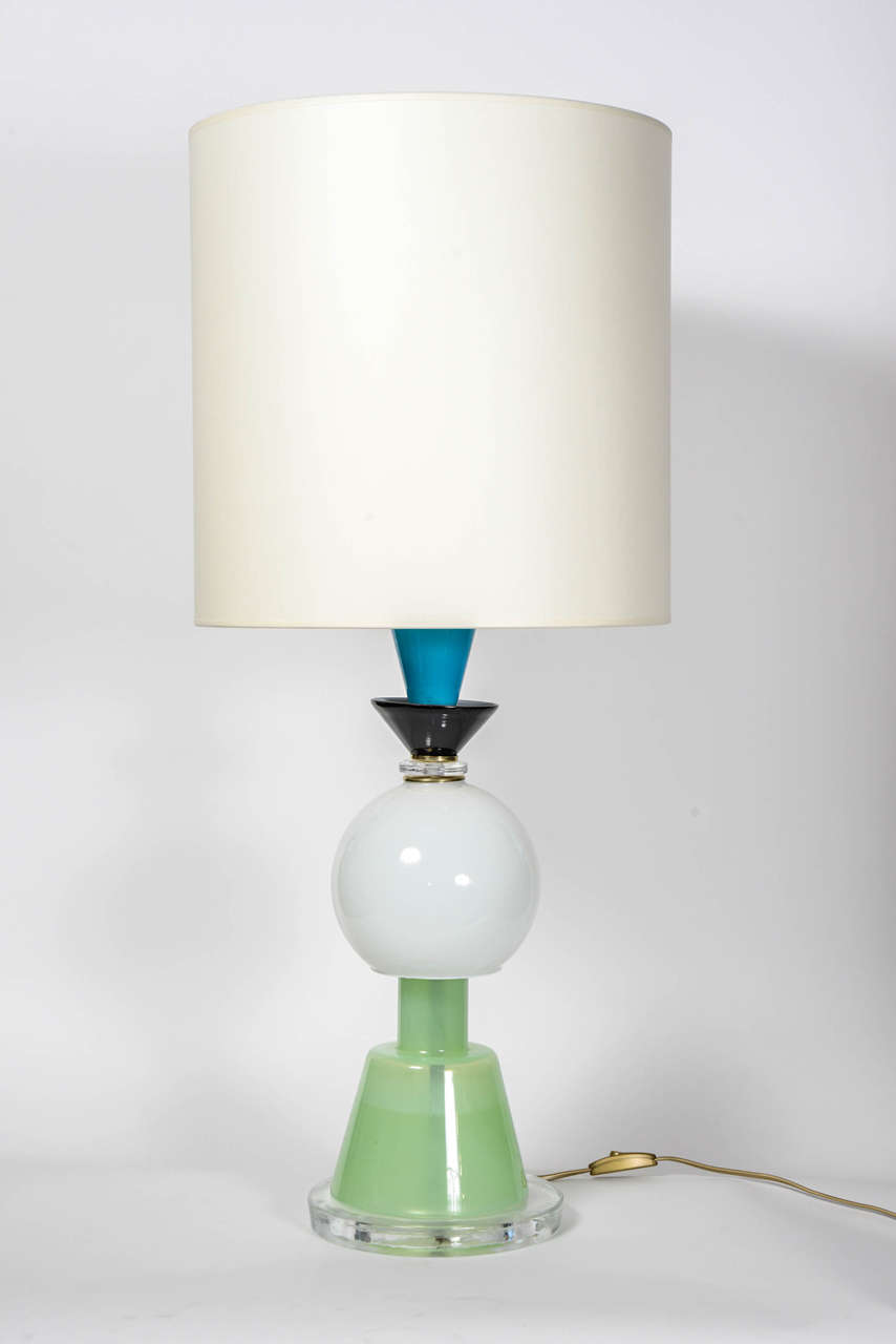 Very unusual pair of lamps made of different colors Murano glass.
The variations of shape and tints of the glass remind the work of Ettore Sottsass.