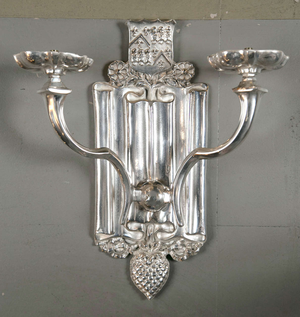 Pair of circa 1920s Caldwell sconces, with shields atop. Eight available.