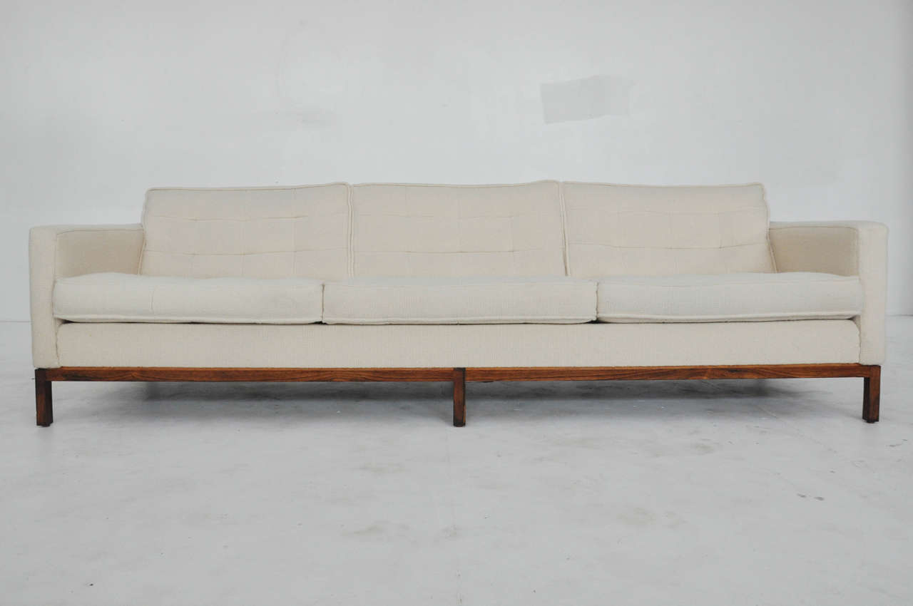 Rare rosewood base Florence Knoll sofa. Base has been refinished. Original Knoll wool fabric does show some wear.
