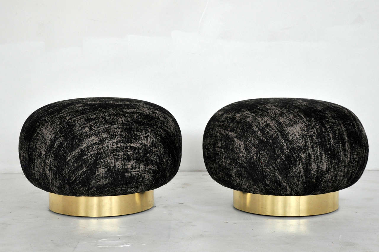 Pair of swivel ottomans by Adrian Pearsall for Comfort Designs. Brass bases with new upholstery.