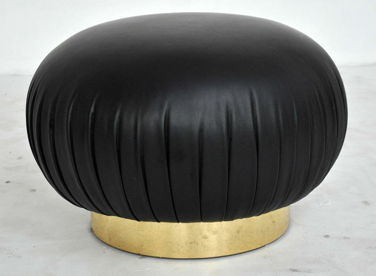 Swivel ottomans by Adrian Pearsall for Comfort Designs. Brass base with new leather upholstery.