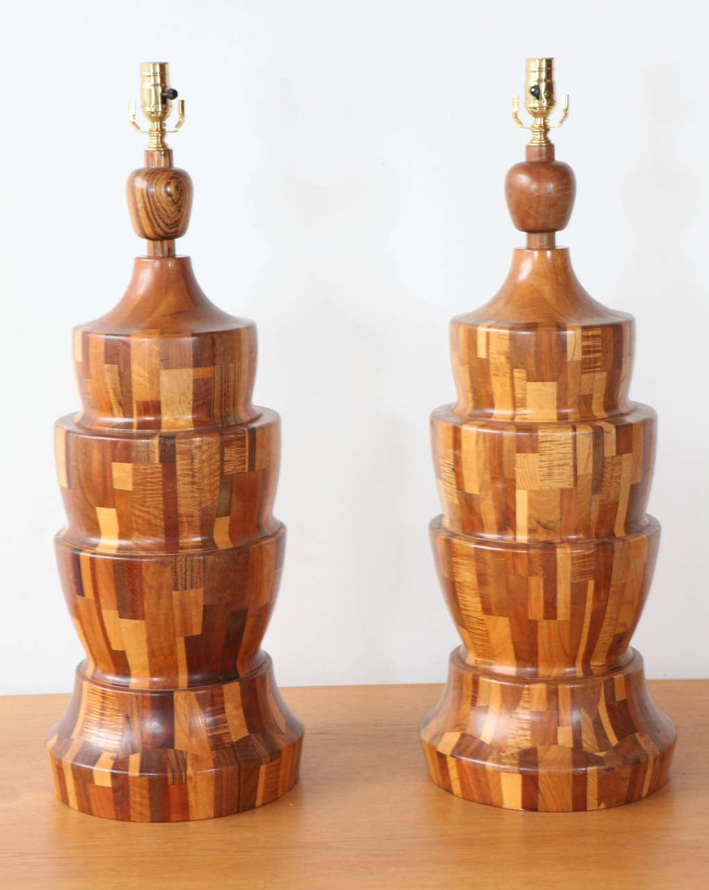 Large tiered table lamps in unique marquetry pattern.