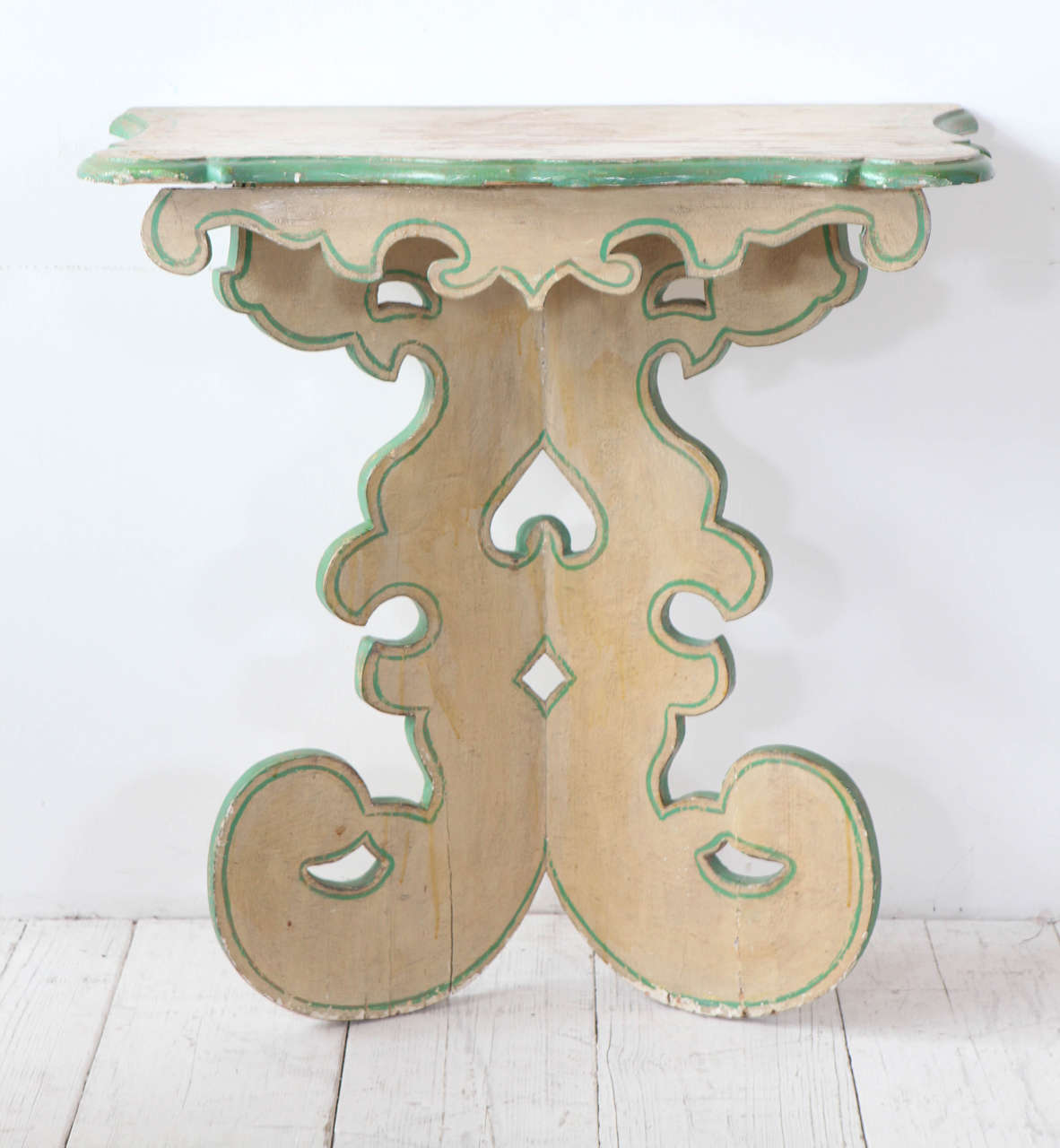 Beautiful carved pedestal / entry table with lyrical curves.