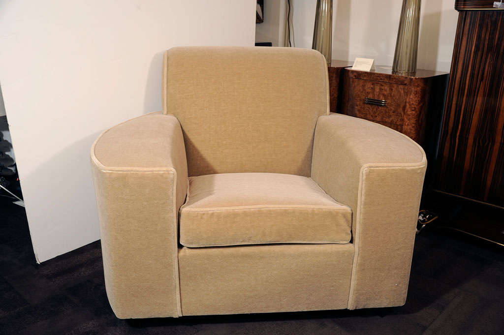Art Deco club chair with streamline<br />
design. Newly upholstered in camel<br />
tone mohair with ebonized walnut<br />
legs.  Matching sofa also available<br />
and sold separately.