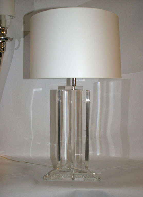 A pair of circa 1960s modernist form table lamps, each crafted of lucite with nickel mounts.
Shades not included