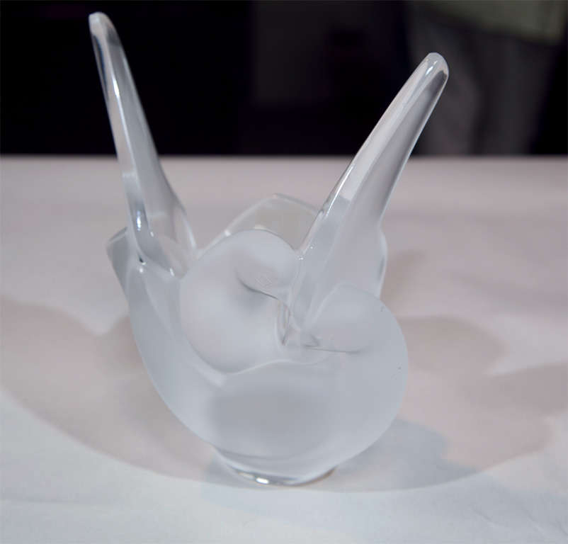 This elegant signed Lalique vase comes with a separate glass flower frog insert to help artistically fan your flower arrangements.