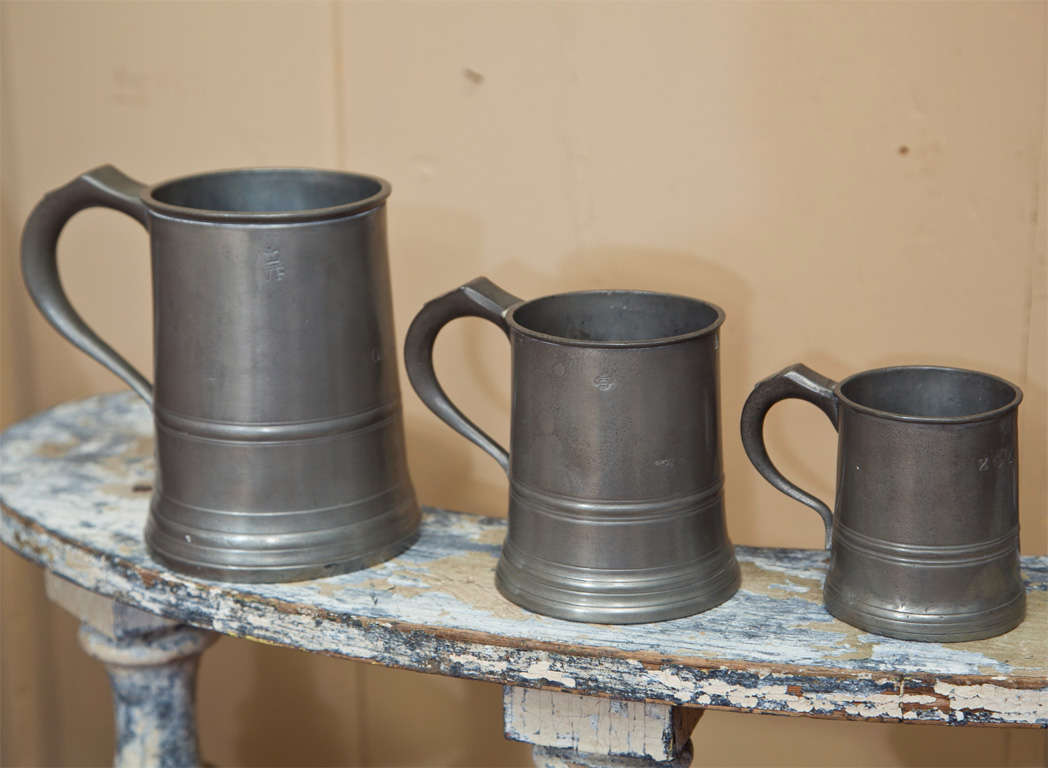 Set of three 19th c. English tankards. All bearing the touchmarks of James Yates 1860-1890, Birmingham England. 
The 19th c. English Pewterer James Yates is considered to be one of the finest and highly regarded for the quality of his pewter