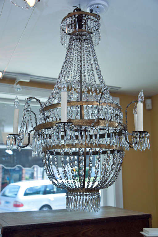 Elegant 19th century Neoclassic Montgolfier crystal chandelier comprised of six etched brass rings, the largest holding six brass arms , Austria, 1820 ca.

 