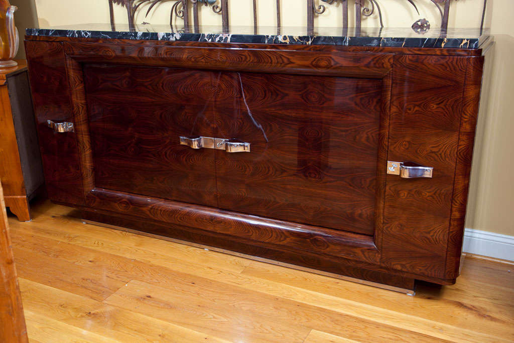 Superb floating French Art Deco Sideboard in macassar ebony, porto buono stone top original, interior comprised of sycamore and handles are nickel plated on bronze, Paris 1930ca

 to view additional items from this dealer, click on their shop name