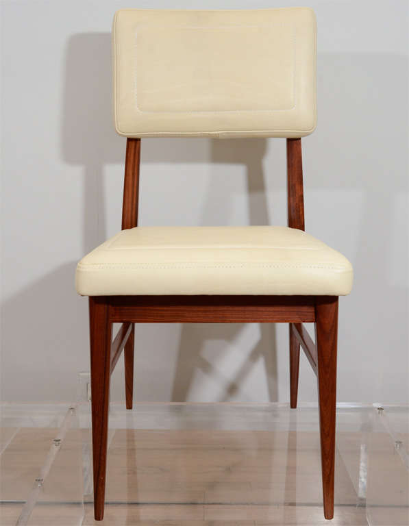 Beautifully executed dining chairs by Raphael Raffel. Topstitched leather seat and back. Seat H 18