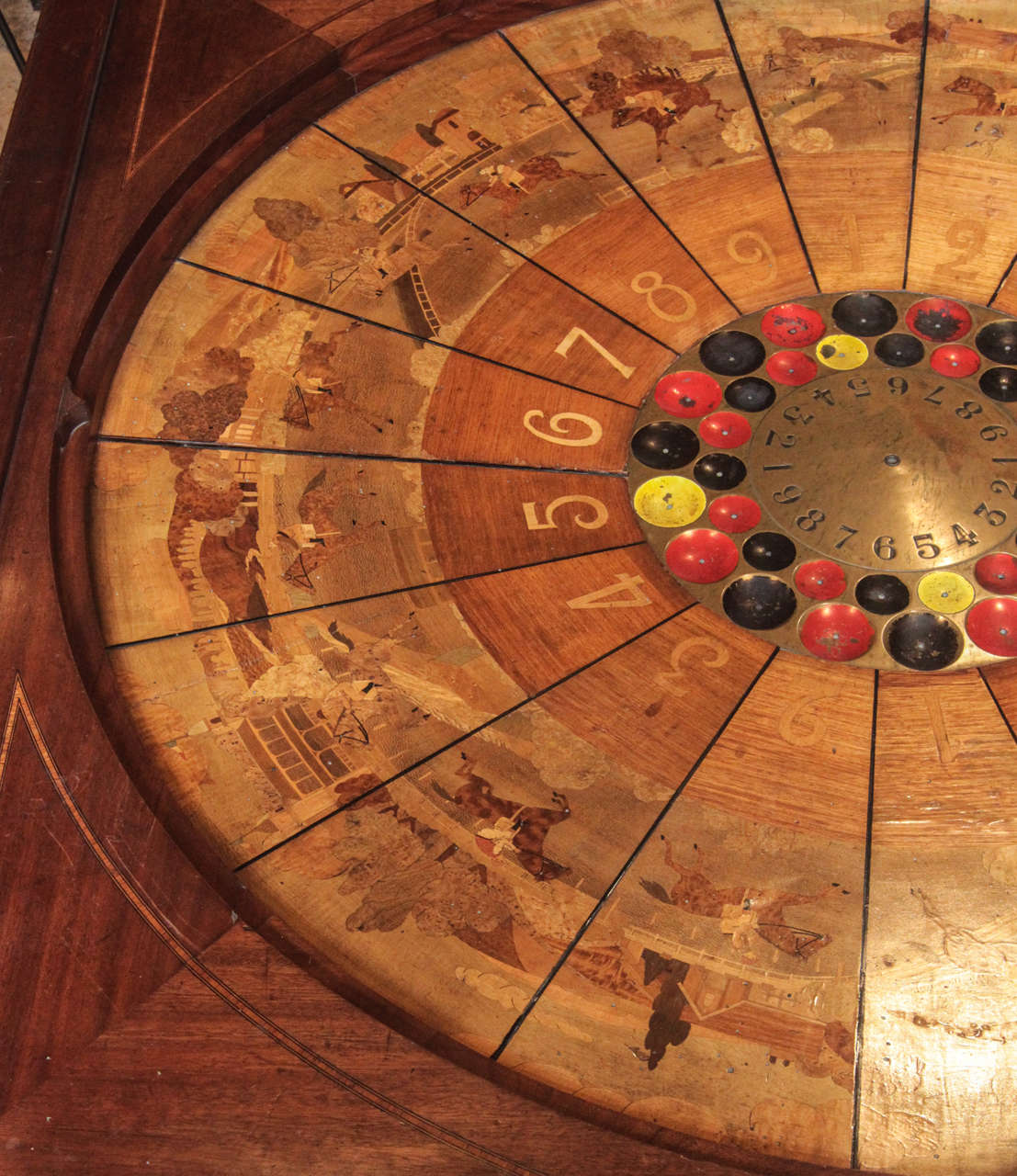 This French Gaming Table (also known as "La Boule") was a predecessor to the game of Roulette. This particular table includes nine separate horse racing scenes in fabulous marquetry, each one is repeated twice.

The piece would make a