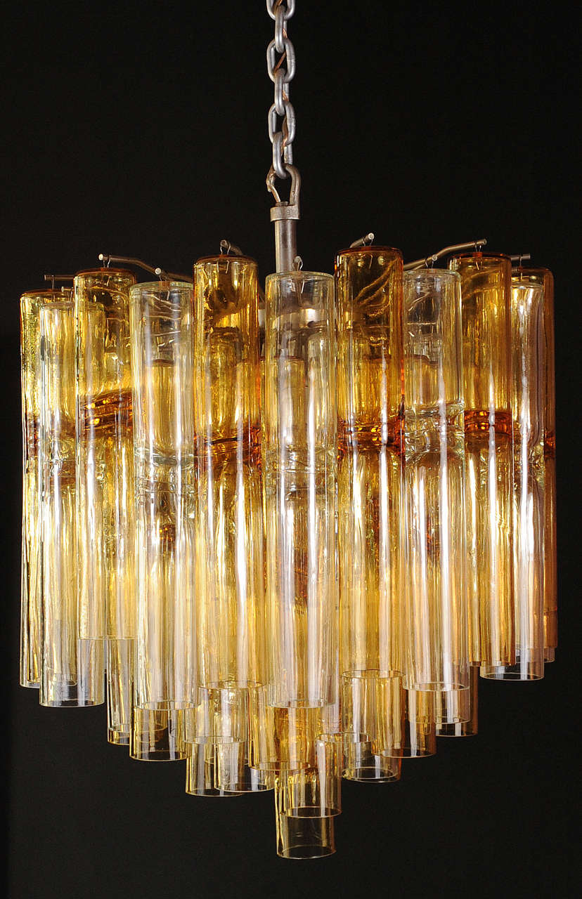 Impressive large Venini chandelier with 59 amber colored and transparent glass tubes of a model called 