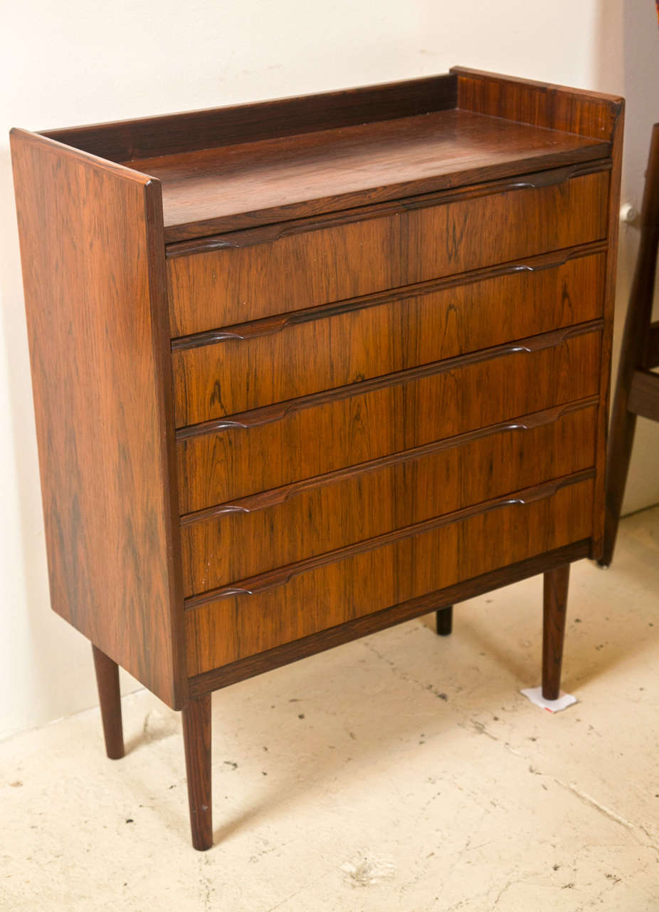 Knud Nielsen designed rosewood five drawer chest in rare small scale.  original finish in beautiful condition.