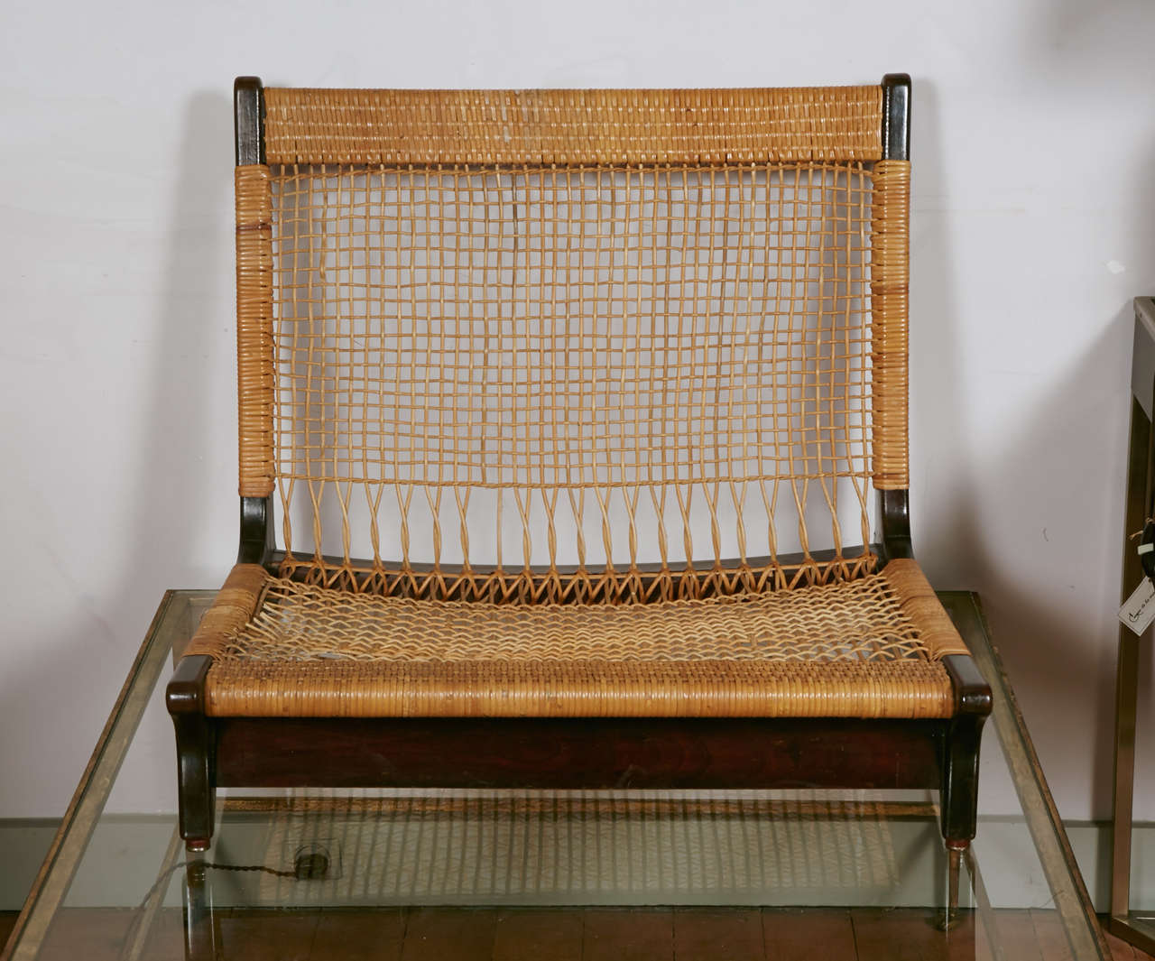 Two wood and cane low chairs by Hans Olsen with a beautiful cushion