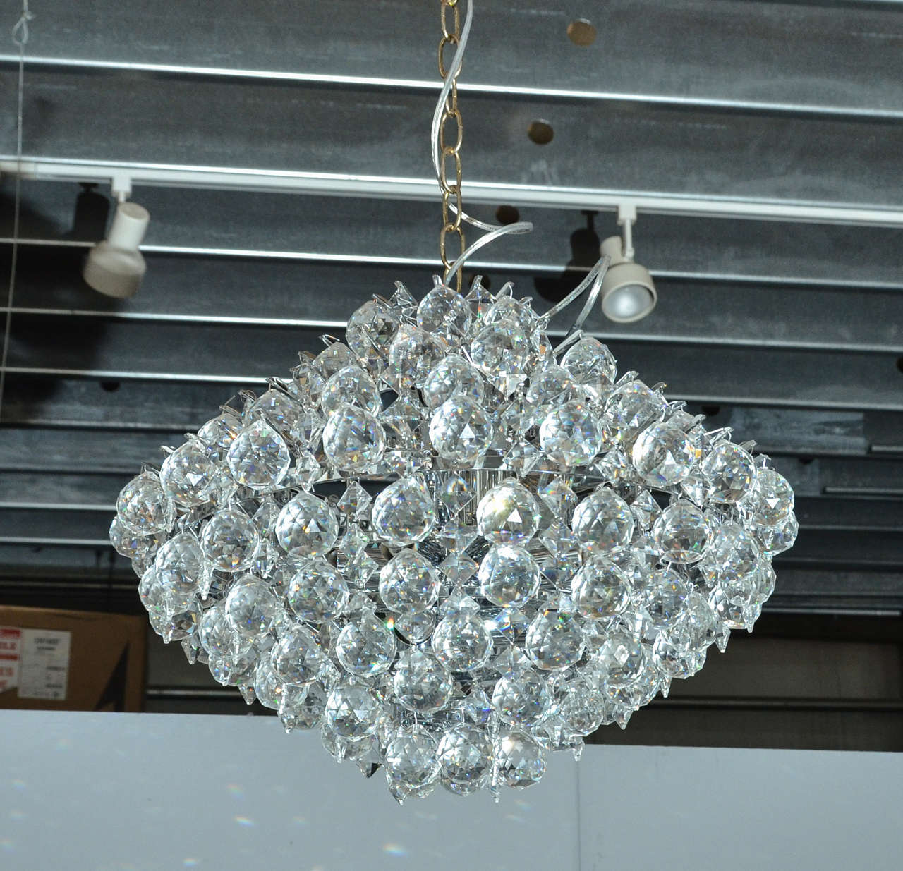 Modern crystal chandelier. Perfect in powder room or entrance hall. Really sings in a small space. High quality extremely sparkly crystal.