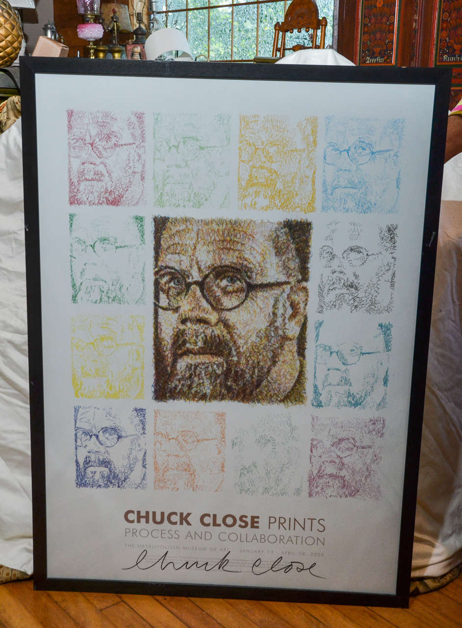 Signed Chuck close poster in custom frame.