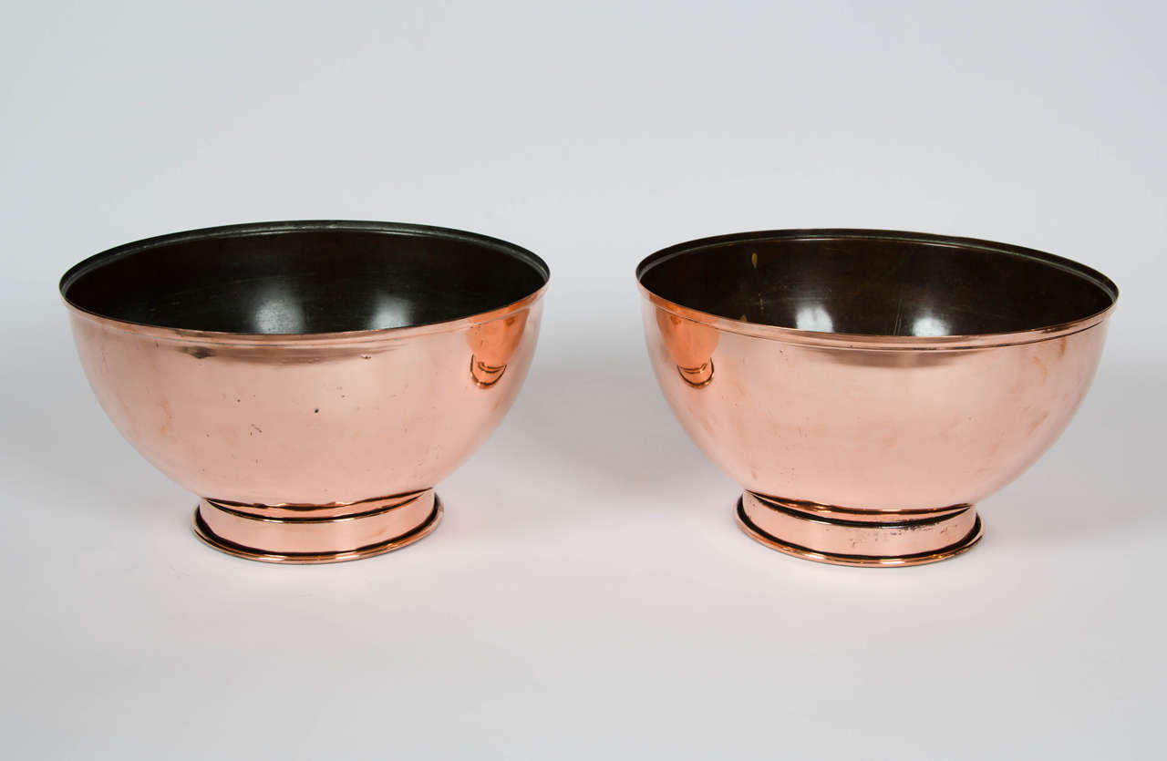 A fabulous pair of early 19th century copper mixing bowls of wonderful shape and form.