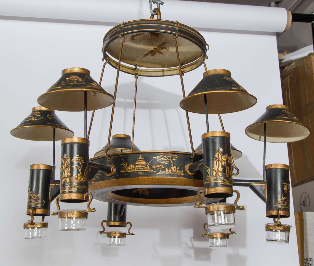 Originally for oil this rare six-light chandelier retains all its original decoration and elements.
Now wired with candle flicker bulbs in each holder and four bulbs concealed in the reservoir to light up the interior shade which gives it a glow,