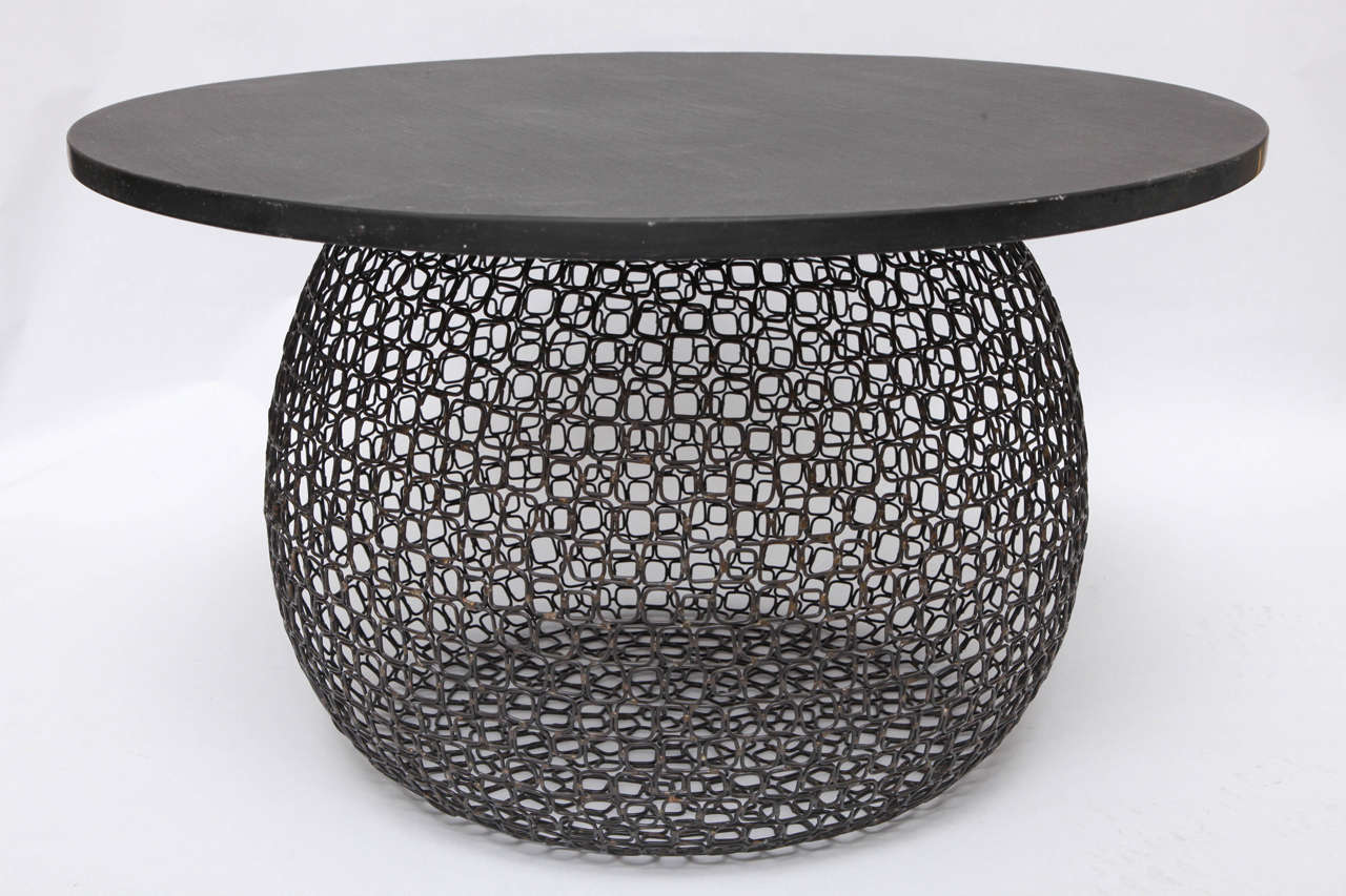 A 1970s Modernist sculptural table handcrafted of metal and granite.