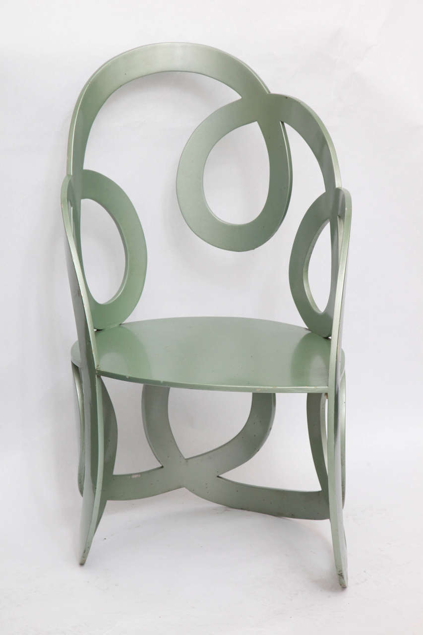 A 1980s sculptural chair crated of painted metal.