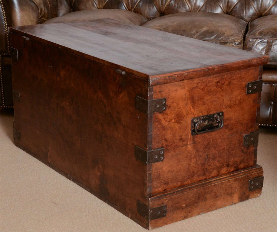 A handsome 19th Century trunk with original faux grained paint and original iron hardware.