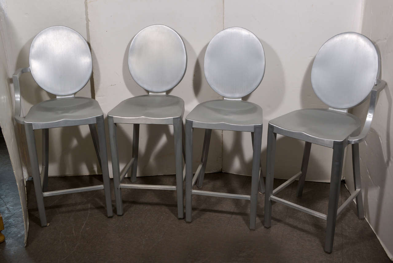 Set of four Philippe Starck counter stools in brushed aluminum. They were first made in 2002 for a Paris restaurant and are virtually indestructible. (Manufactured by Emeco).